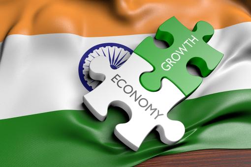 Economy and growth jigsaw on Indian flag