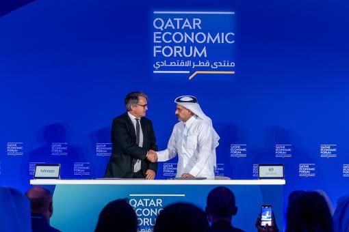 Mark Coombs, Chief Executive Officer, Ashmore Group plc, shakes hand hands with Yousuf Mohamed Al-Jaida, Chief Executive Officer, Qatar Financial Centre Regulatory Authority.