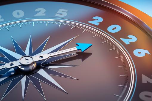 Dark stylish compass with needle pointing to the year number 2026
