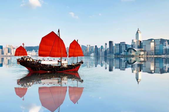 Junk boat crossing Hong Kong harbour