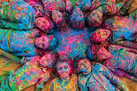 Happy Indian children playing holi, desert village, India