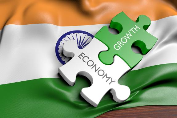 Economy and growth jigsaw on Indian flag